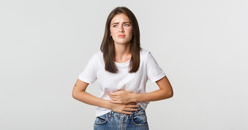 Women Experiencing Gastric Problem | Gastric Problems Symptoms